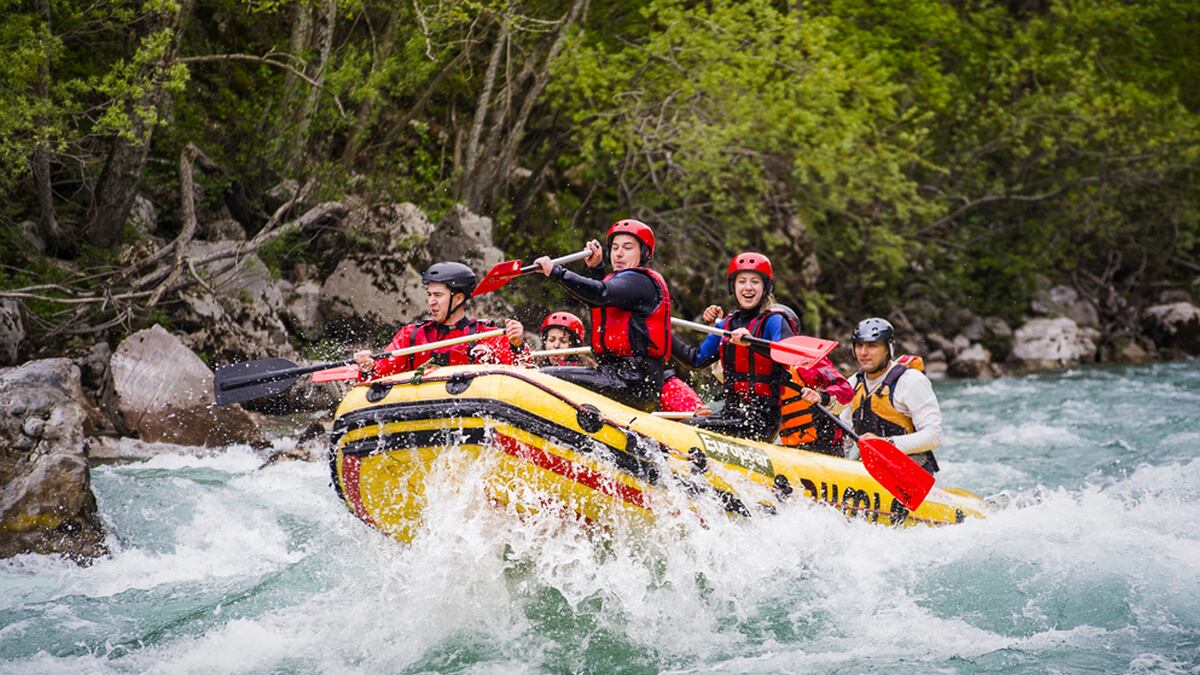 Rafting group on a river with jungle surroundings