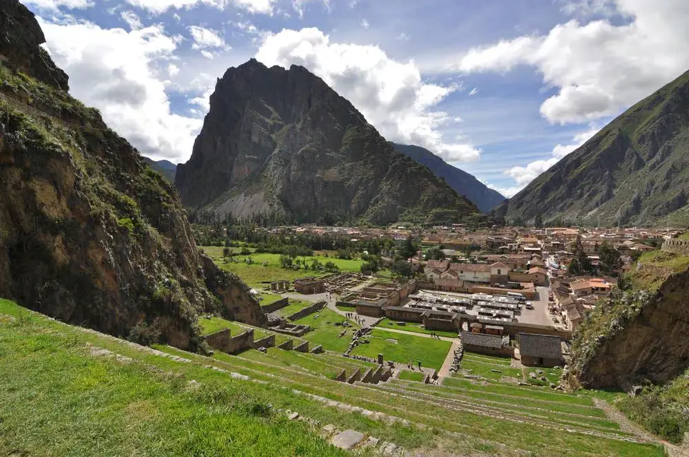 Hiker with backpack looking at Machu Picchu mountains